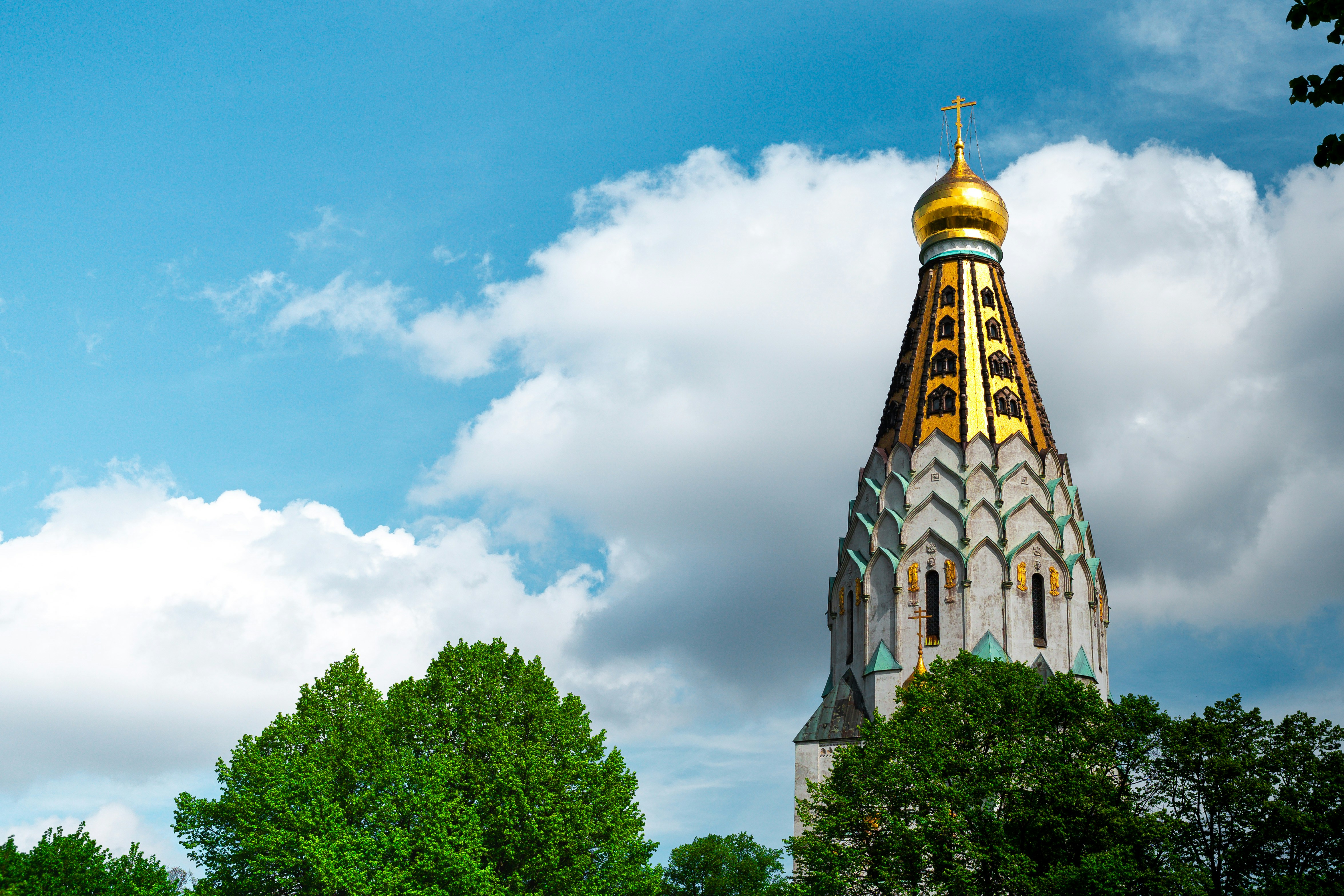 A very tall building with a gold dome on top
