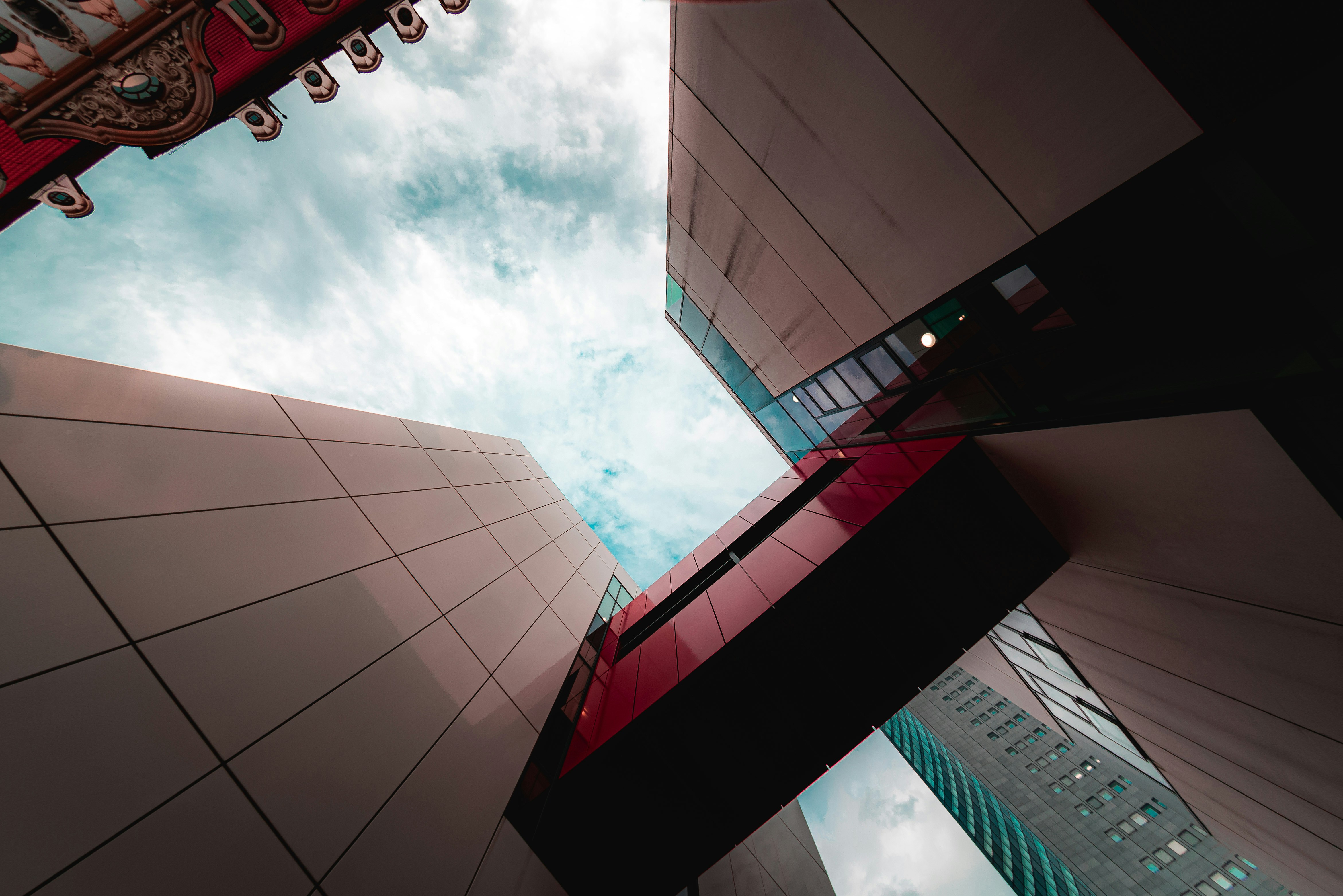 Looking up at a tall building with a sky background