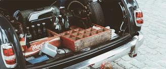 Groceries secured in crates inside an organized car trunk
