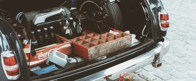 Groceries secured in crates inside an organized car trunk