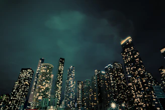 A city at night with a lot of tall buildings