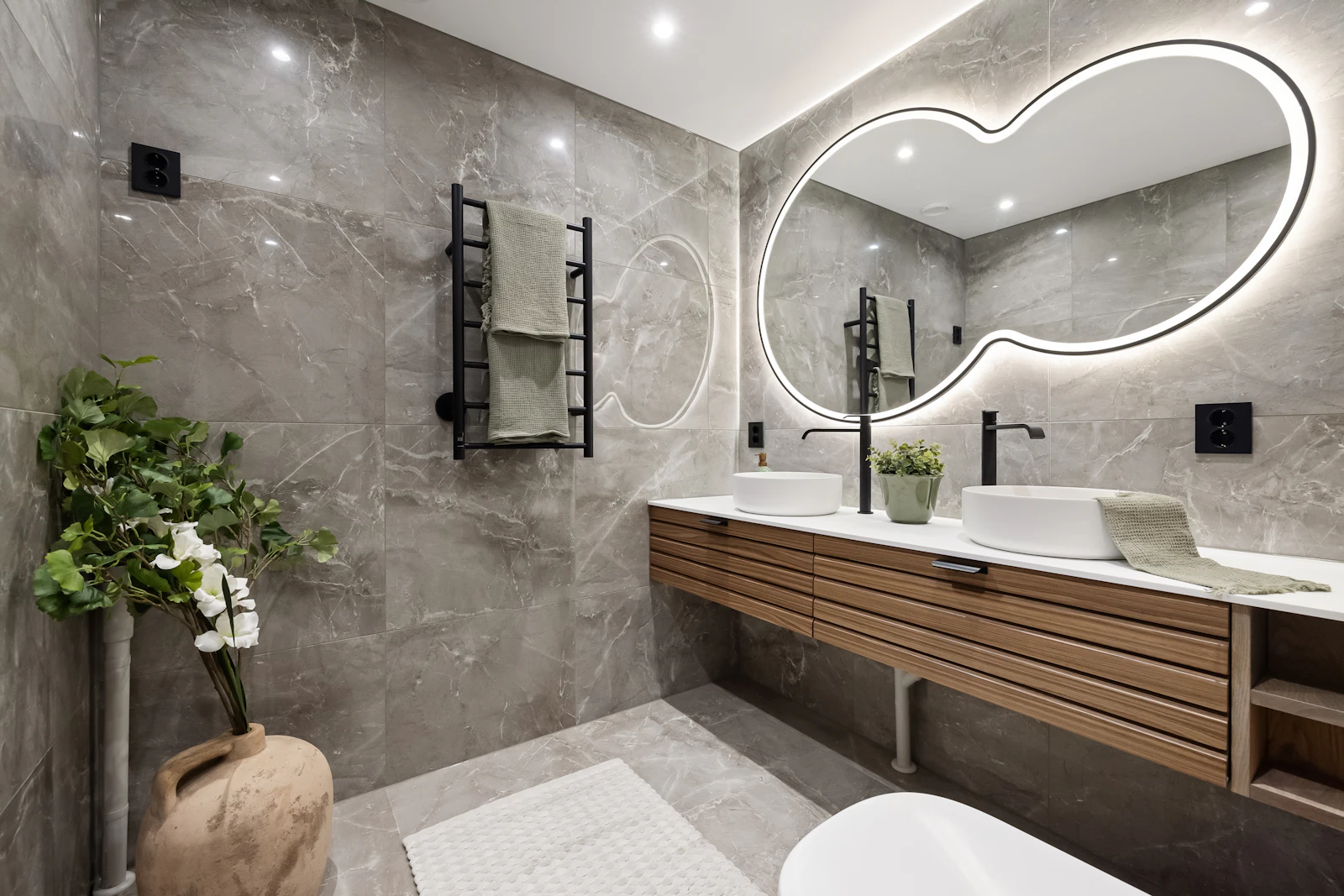 Bathroom with a large mirror above the sink
