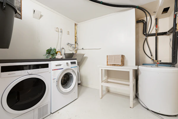 Washer and dryer set in a home laundry room