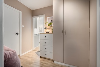 A bedroom with a bed and a closet