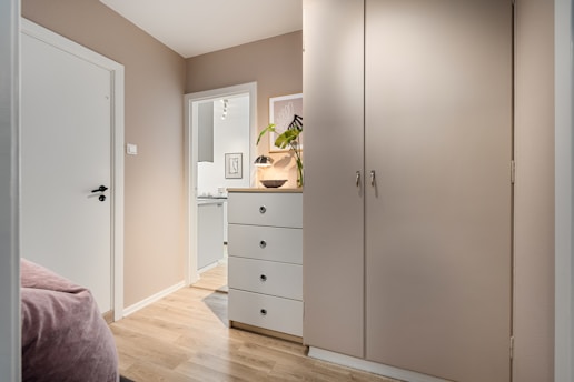 A bedroom with a bed and a closet