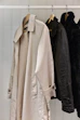 A coat rack with coats hanging on it