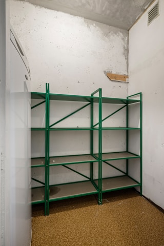 A room with a bunch of shelves in it