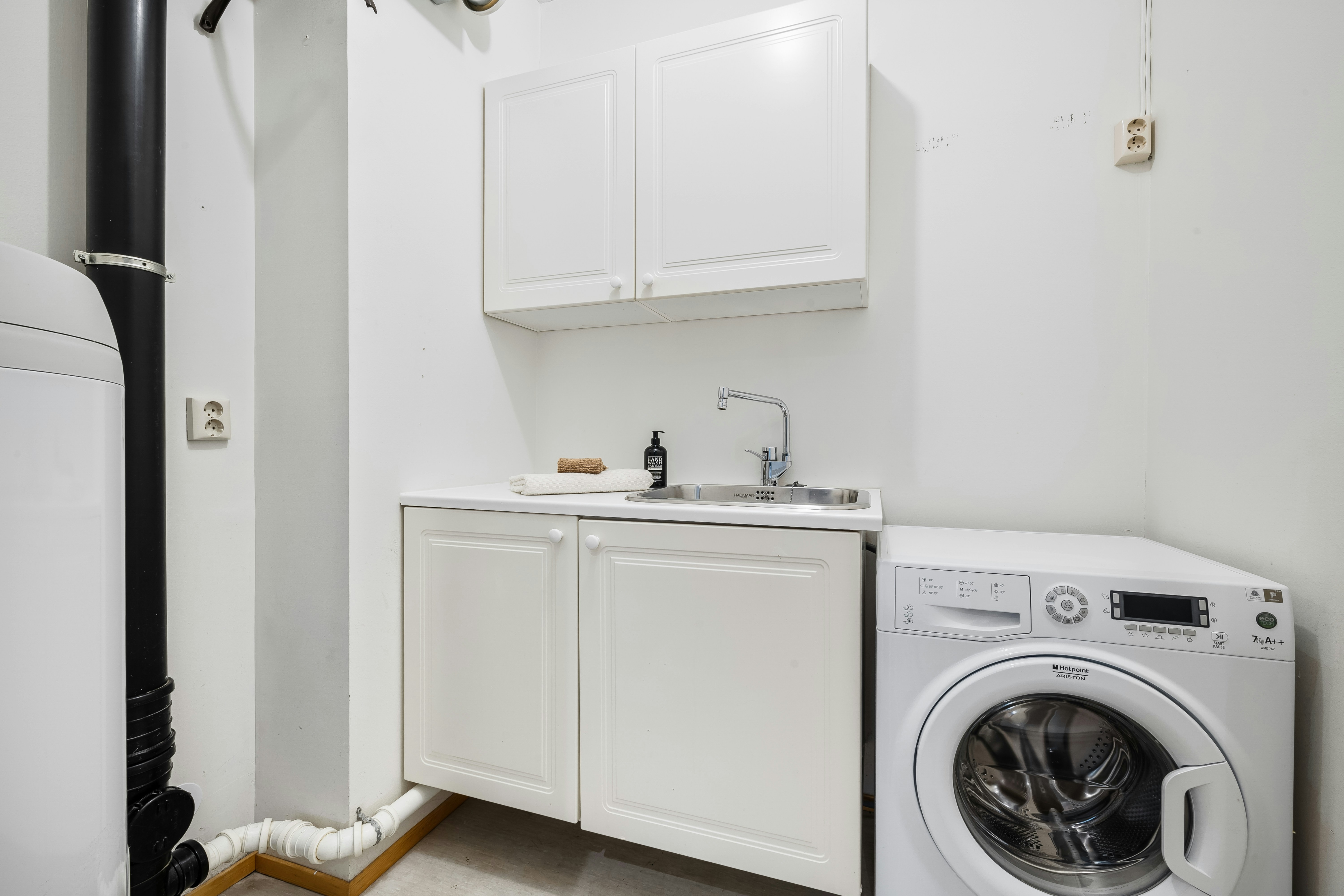 A washer and dryer in a small room