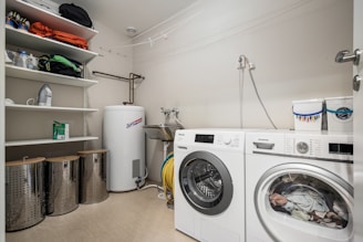 A laundry room with a washer and dryer