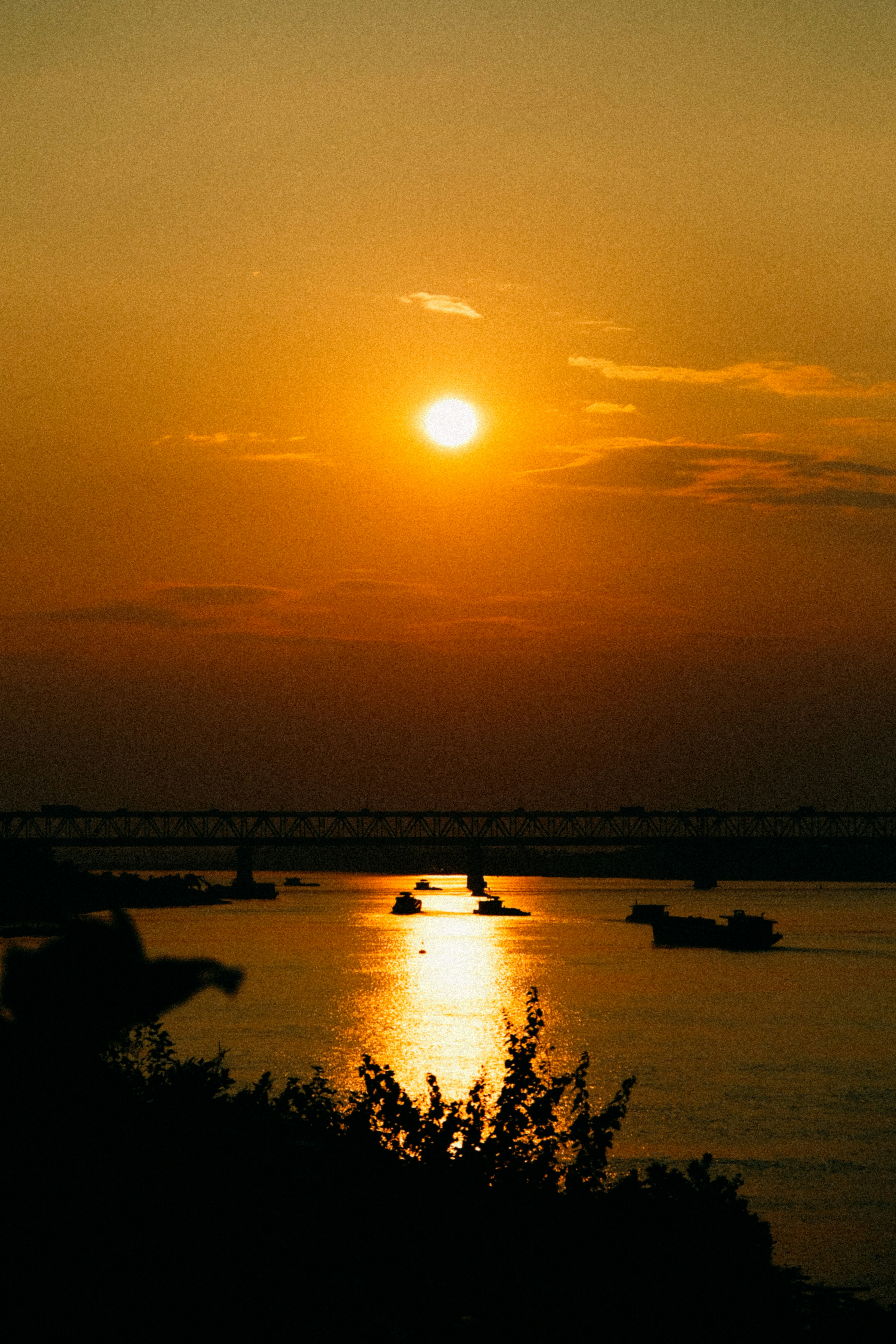 The sun is setting over a body of water