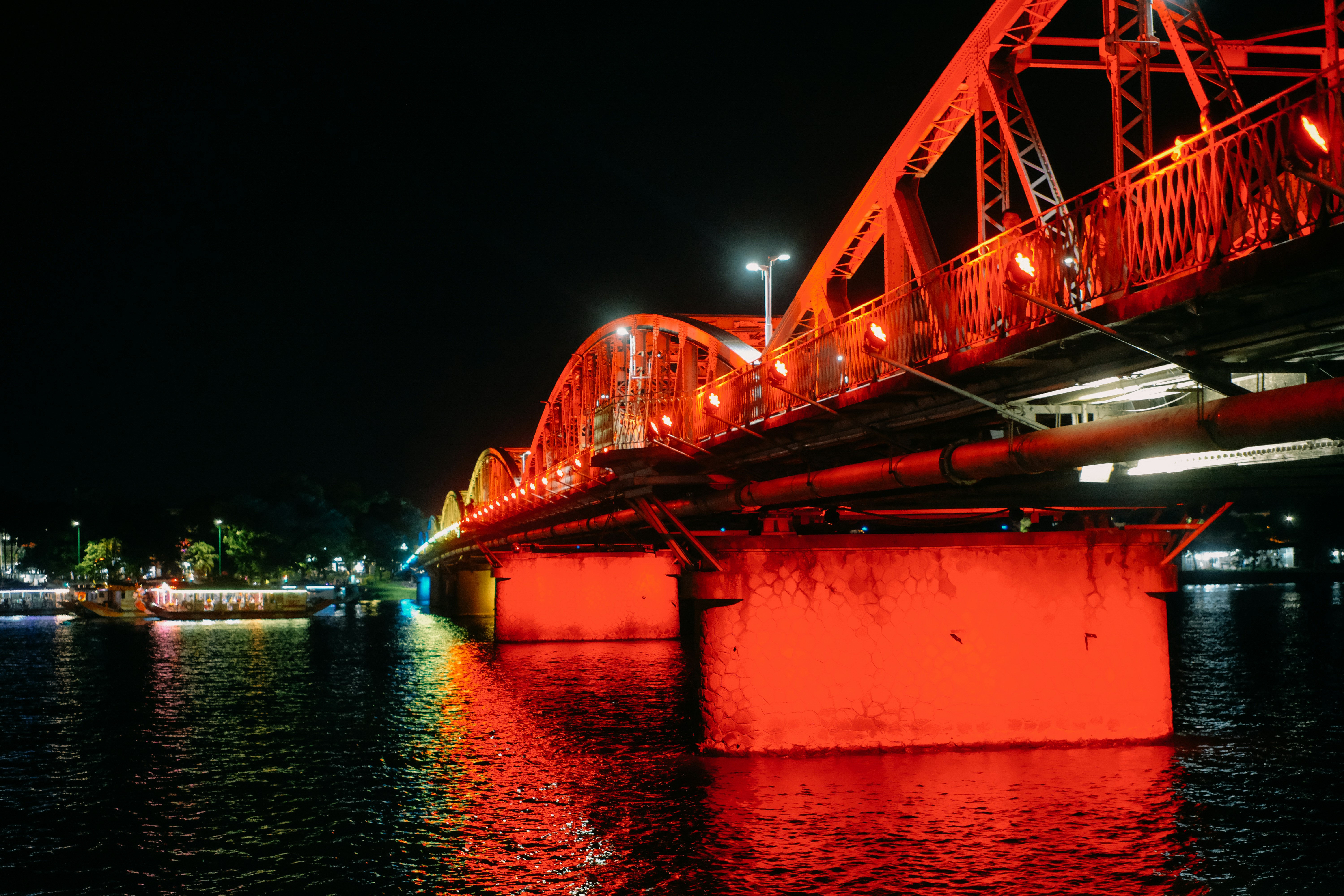 A bridge over a body of water at night