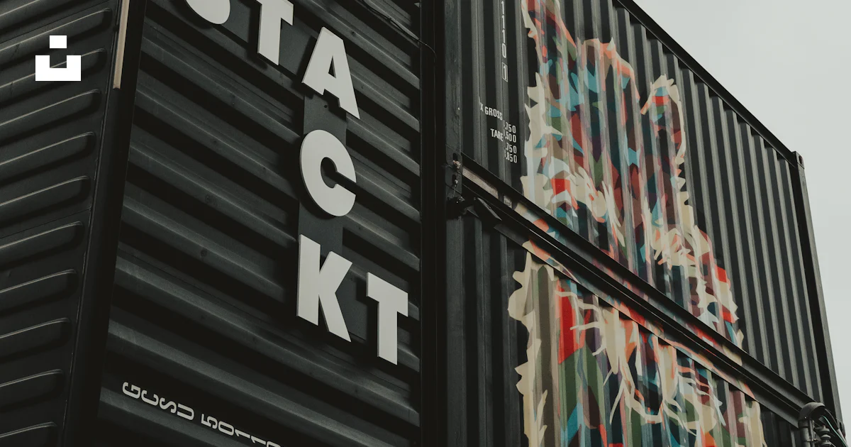 Container Stack Sign A stack of shipping containers sitting on top of each other photo ...