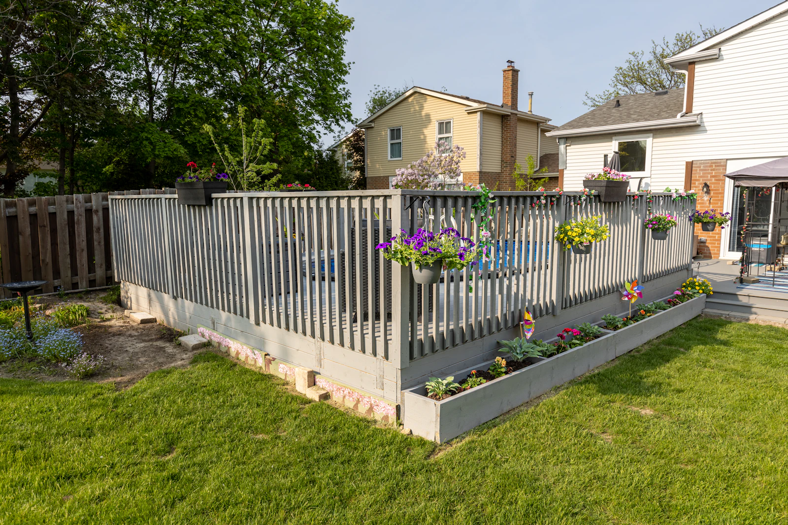 A backyard deck and fence under construction