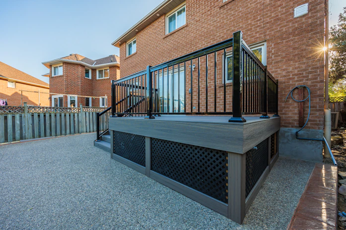 A large hot tub sitting next to a brick building