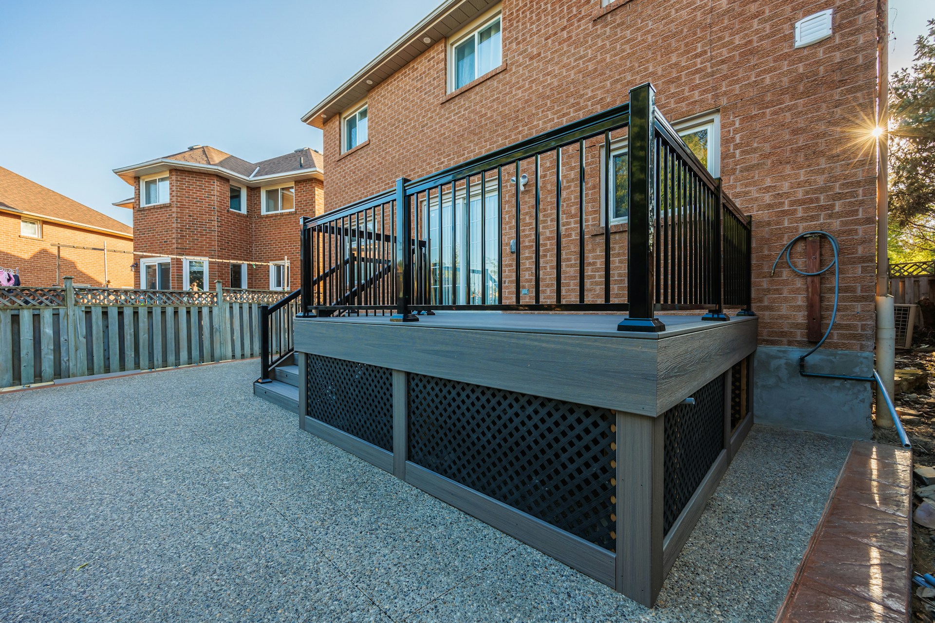 A large hot tub sitting next to a brick building