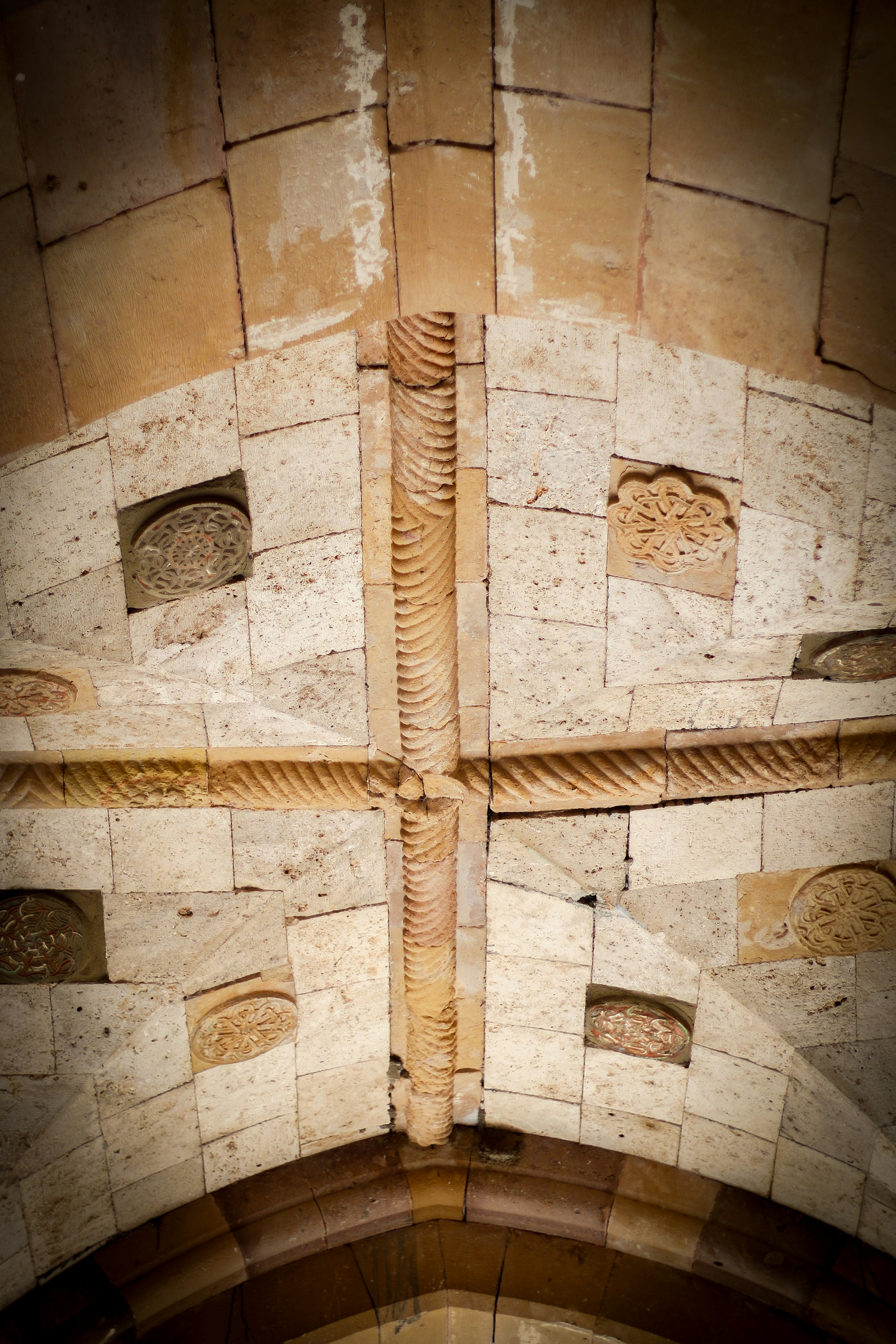 A cross on the wall of a building