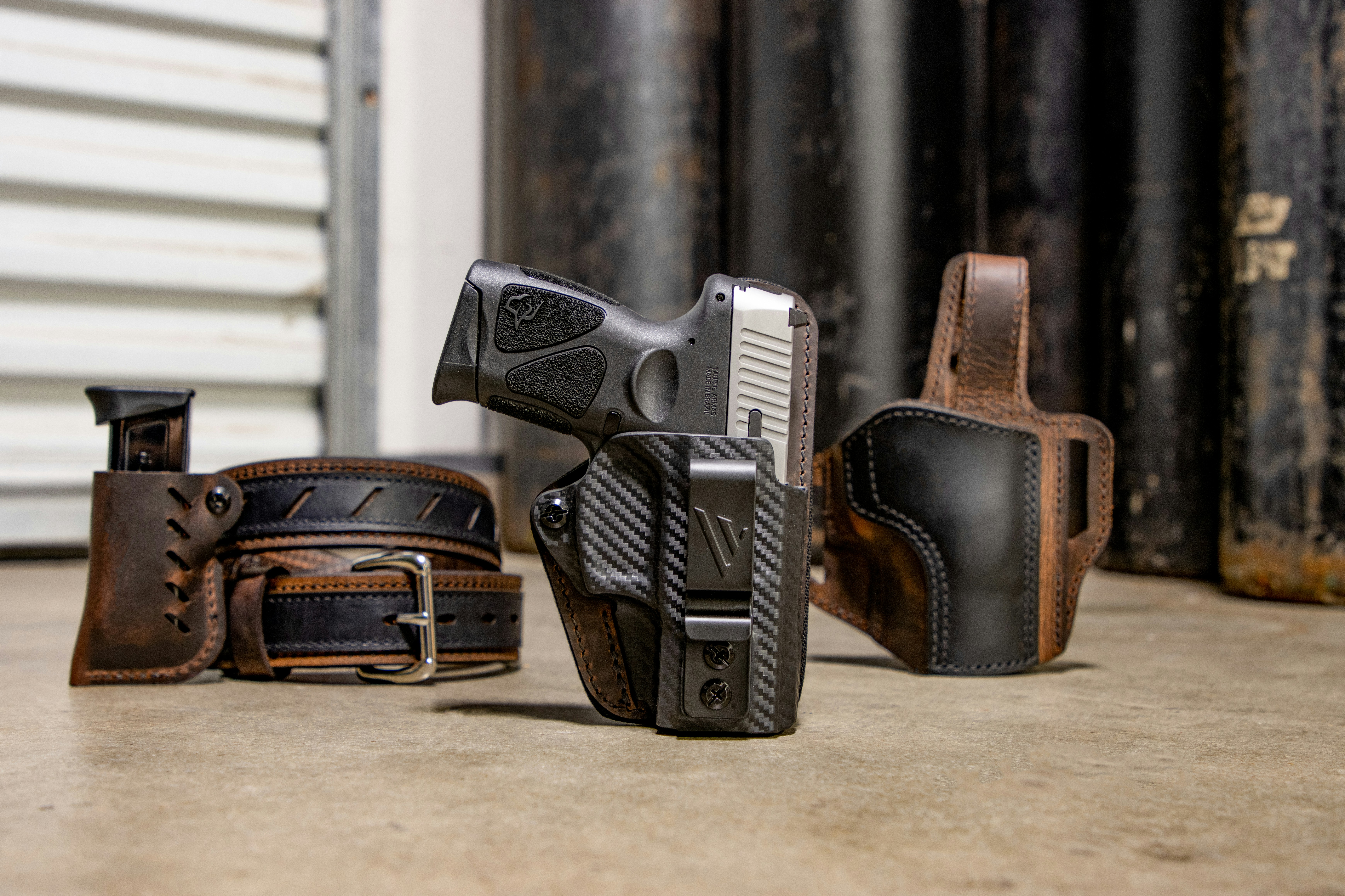 A group of different types of guns on the ground