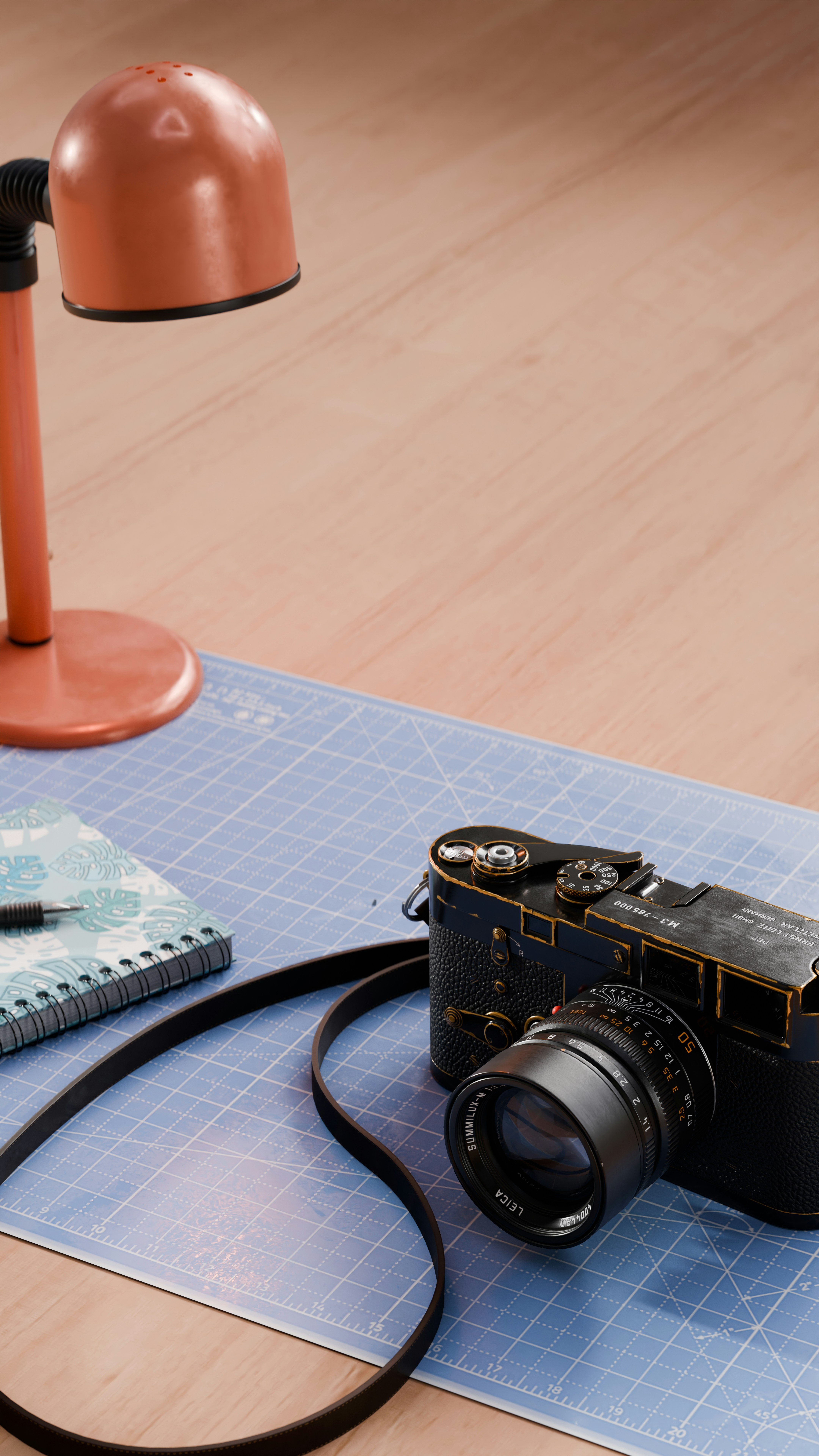 A camera sitting on top of a table next to a lamp