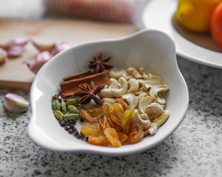 A white bowl filled with different types of food