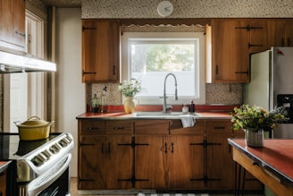 A kitchen with wooden cabinets and a stove top oven