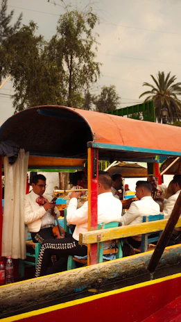 A group of people riding on top of a boat