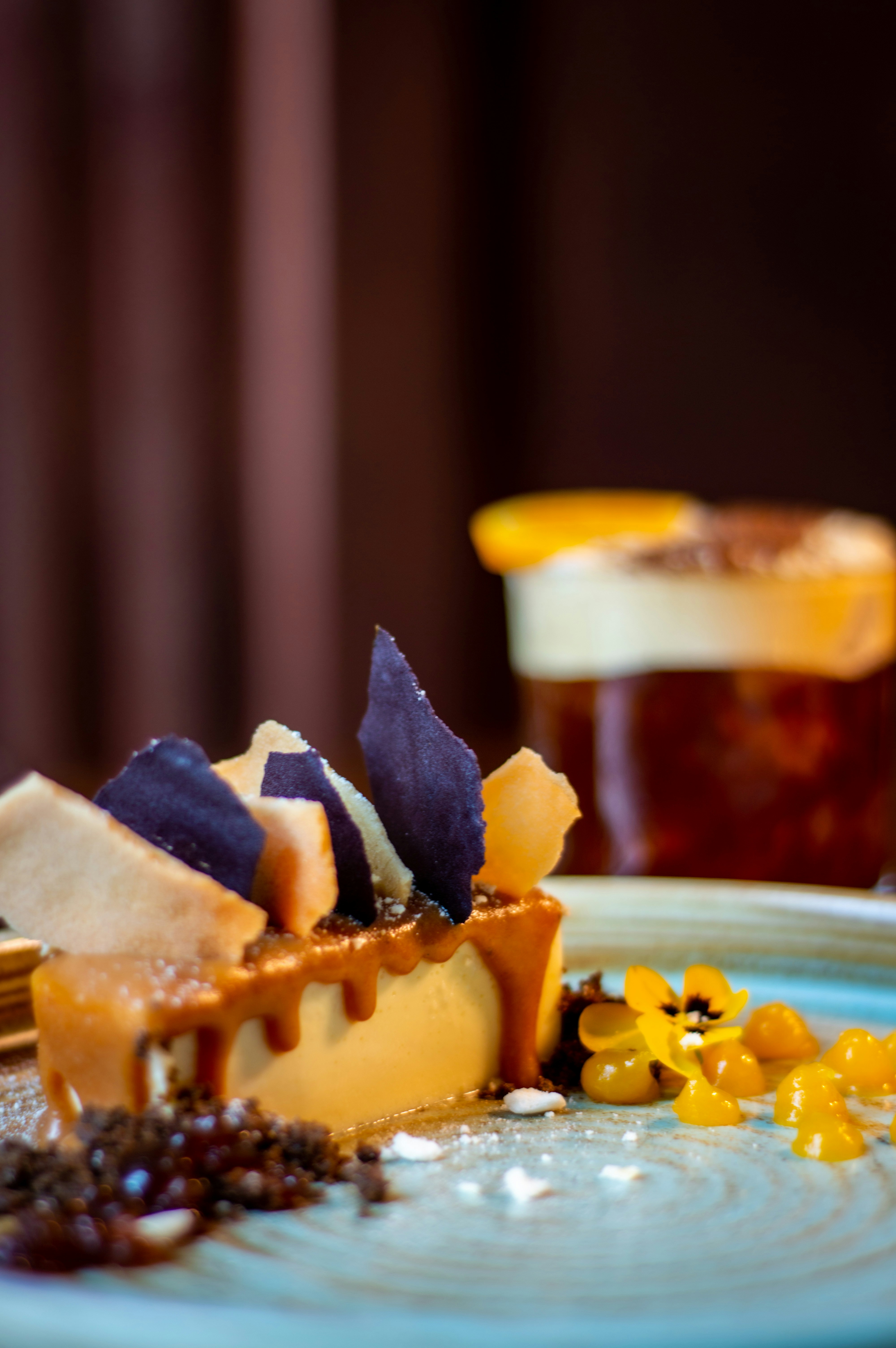 A blue plate topped with a piece of cake