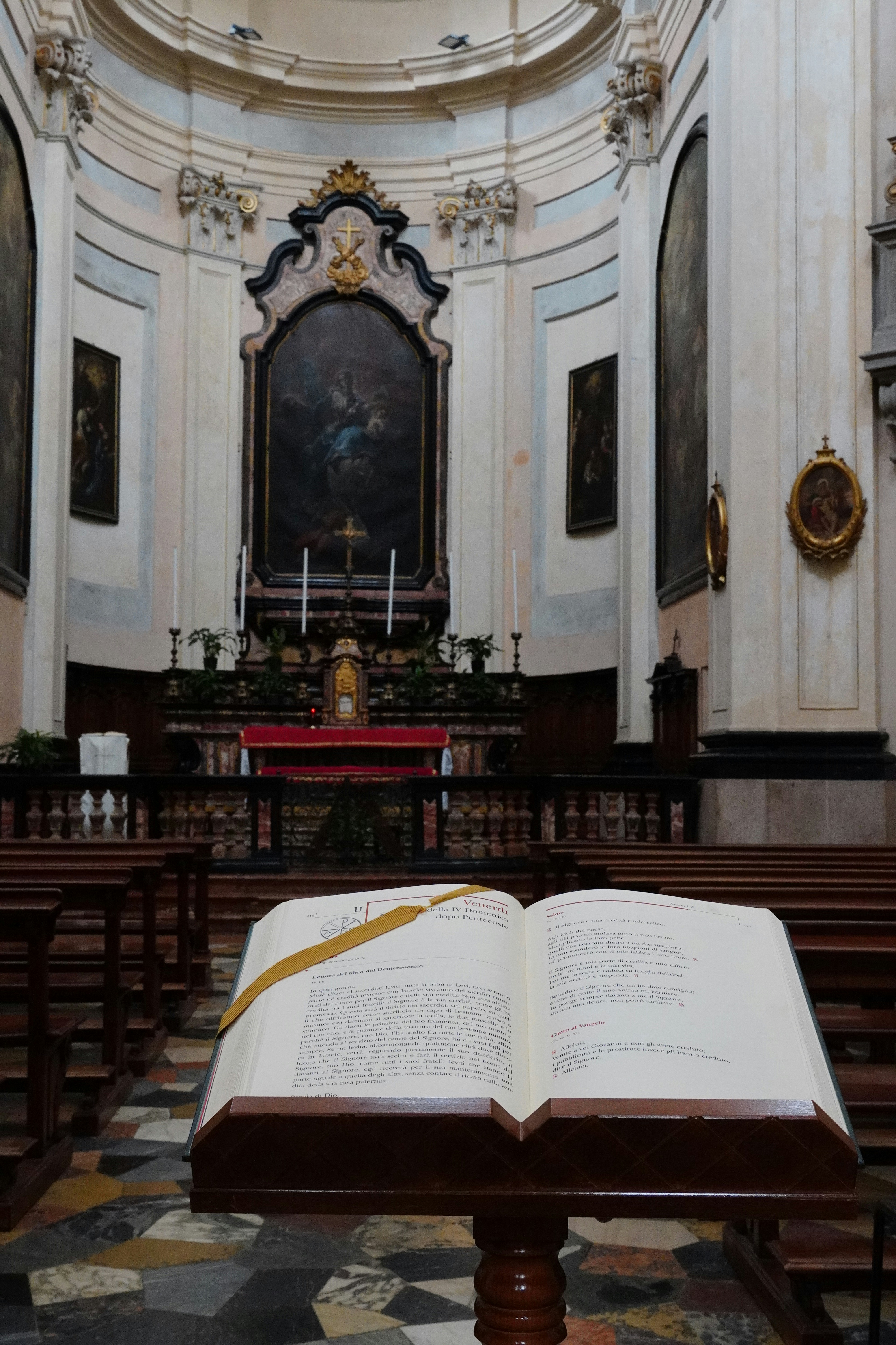 An open book sitting in the middle of a church