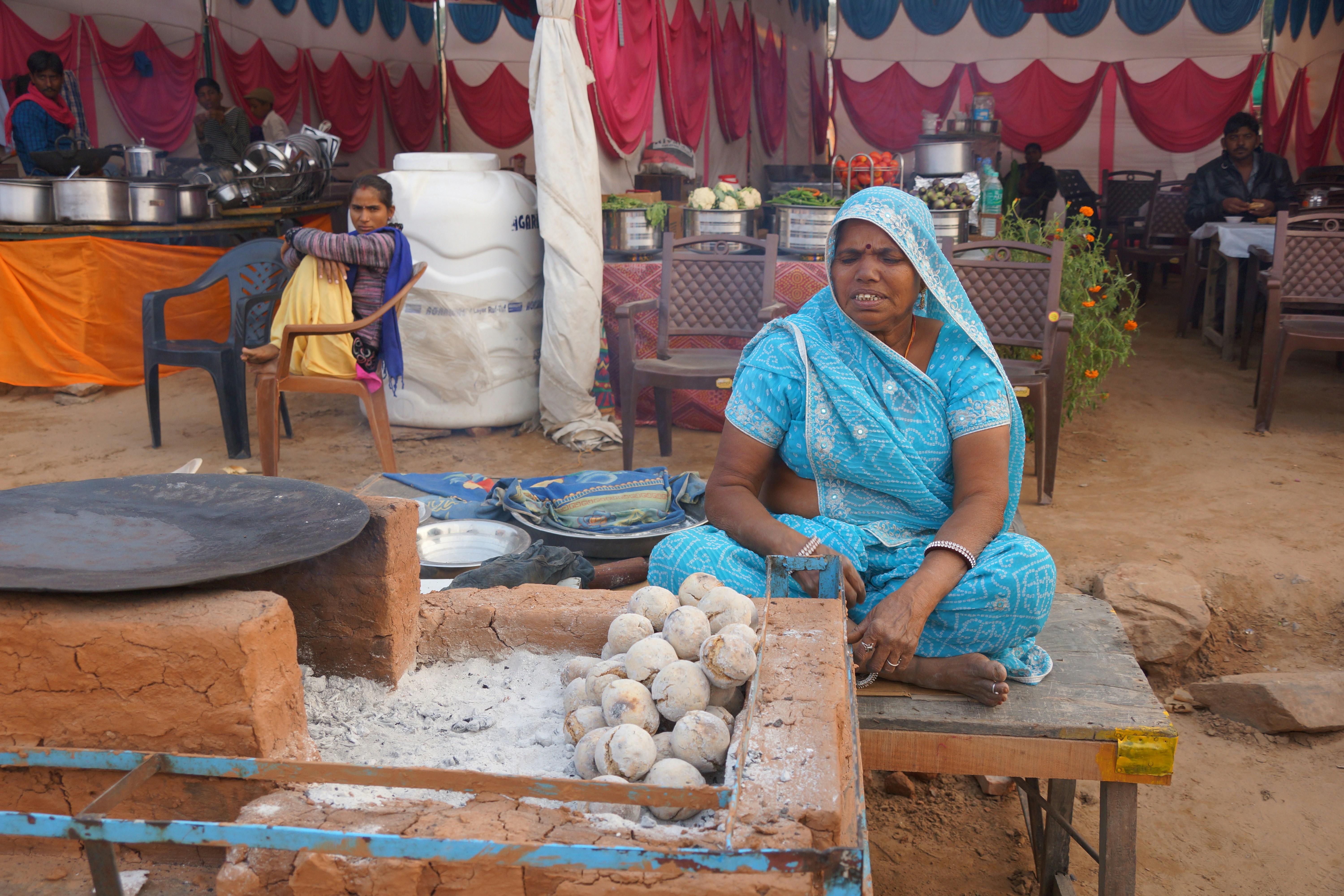 Woman cooking with food spread