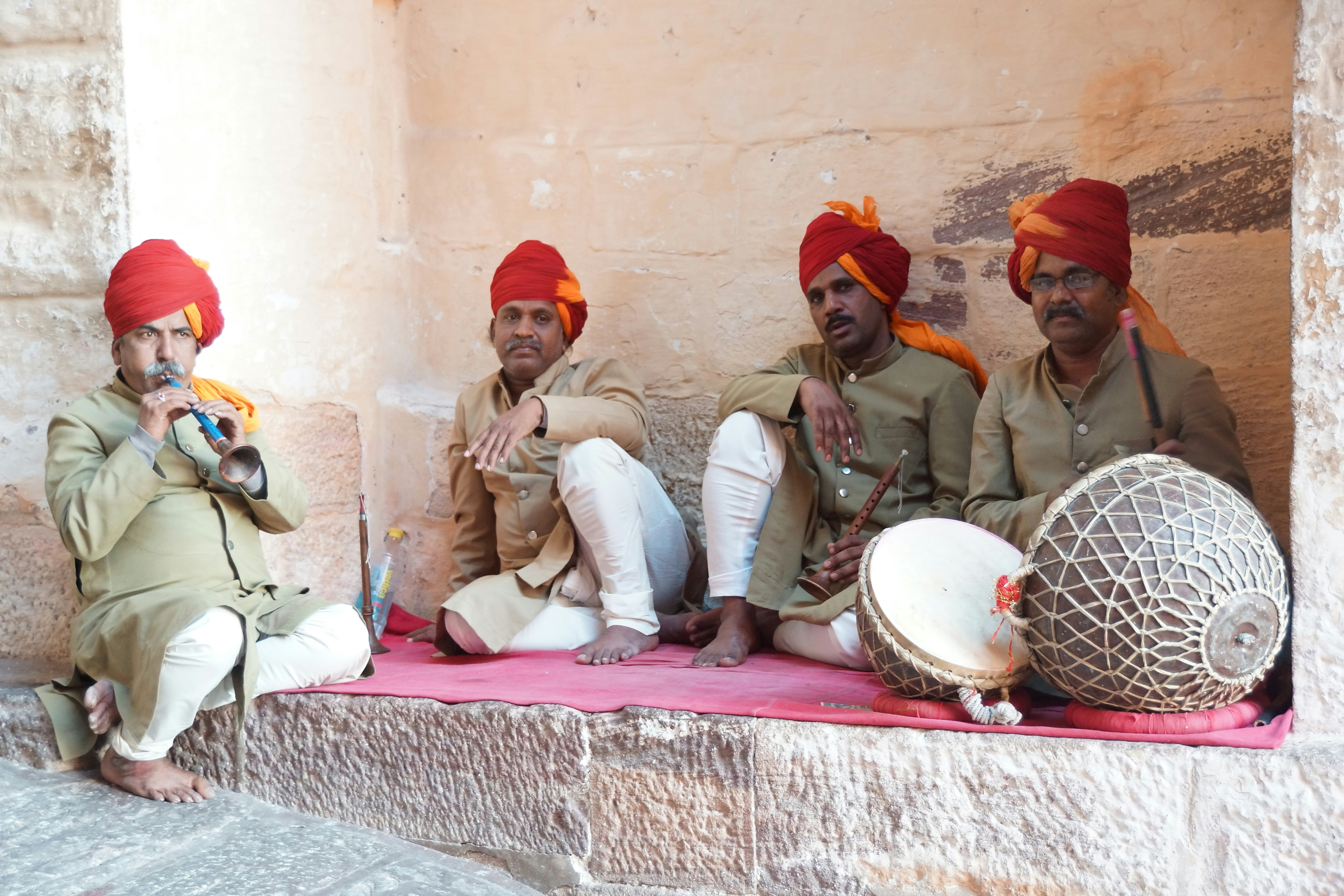 A group of men sitting next to each other