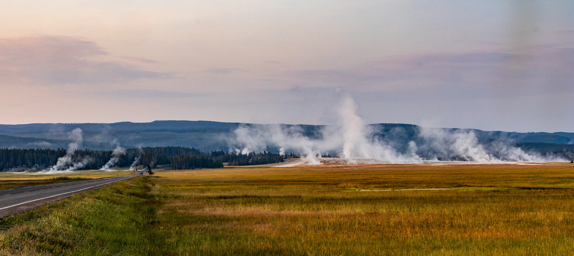 A road that has a lot of steam coming out of it