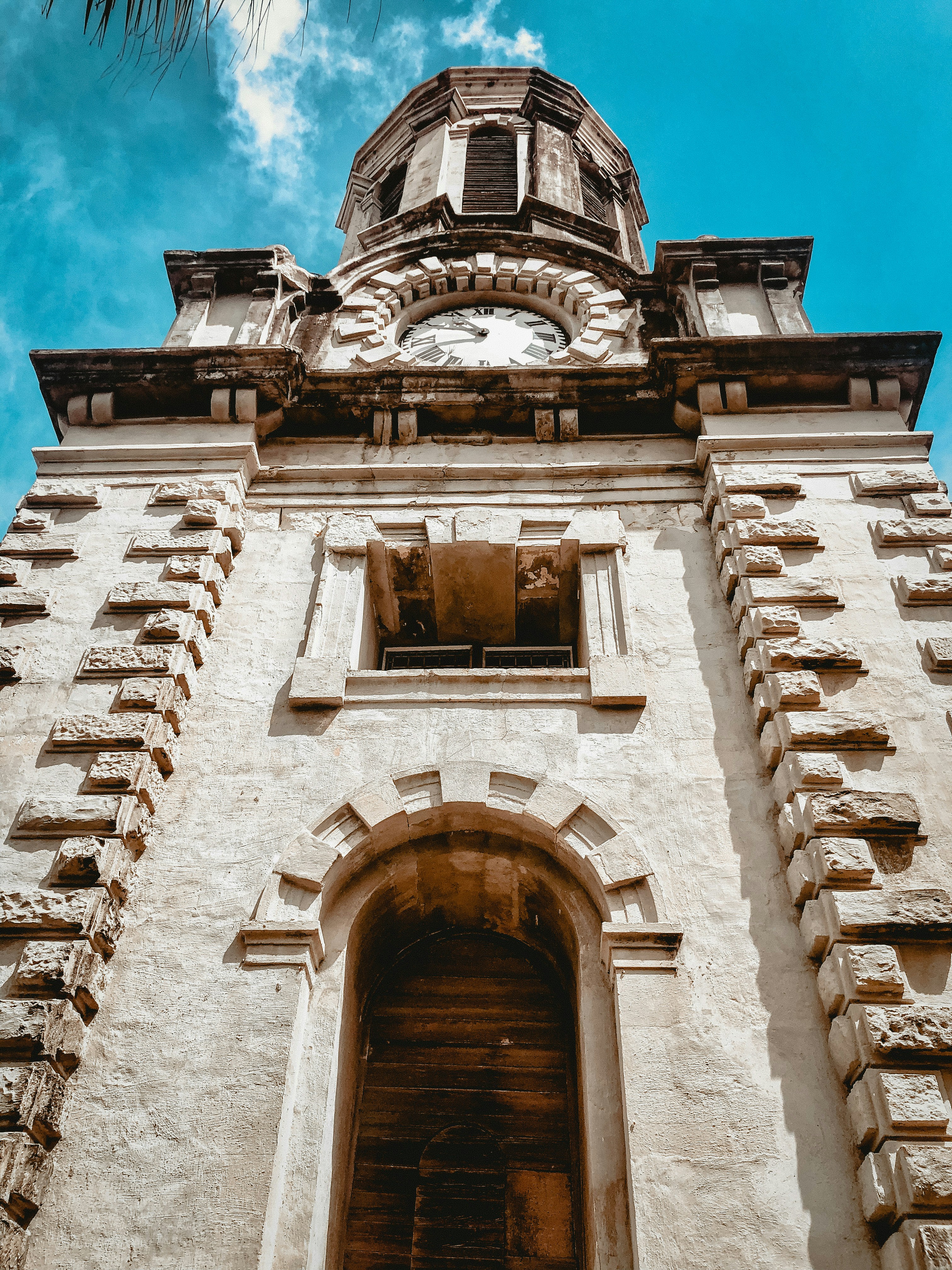 A tall tower with a clock on the top of it