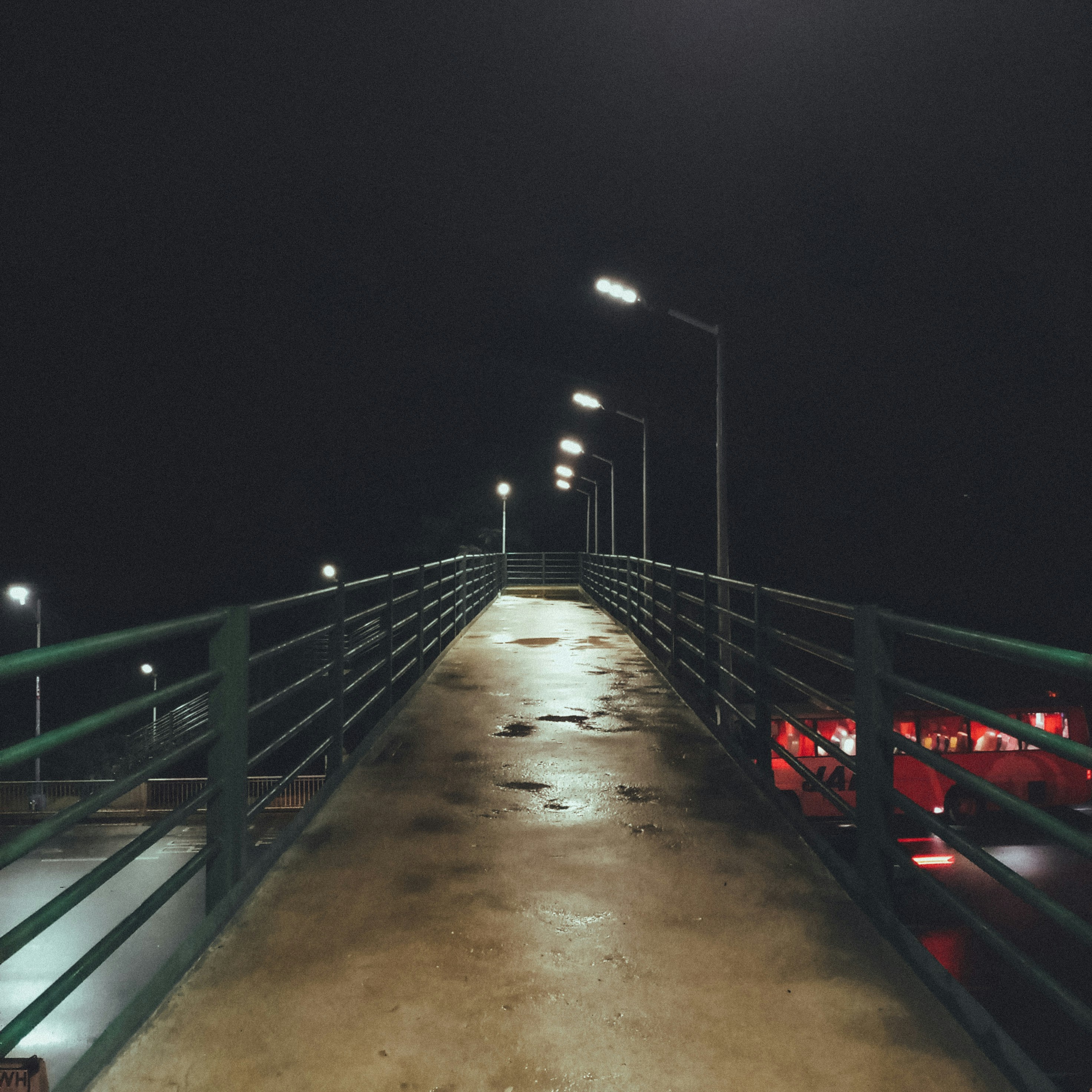 A bridge that has some lights on at night