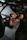 A woman lifting a barbell in a gym