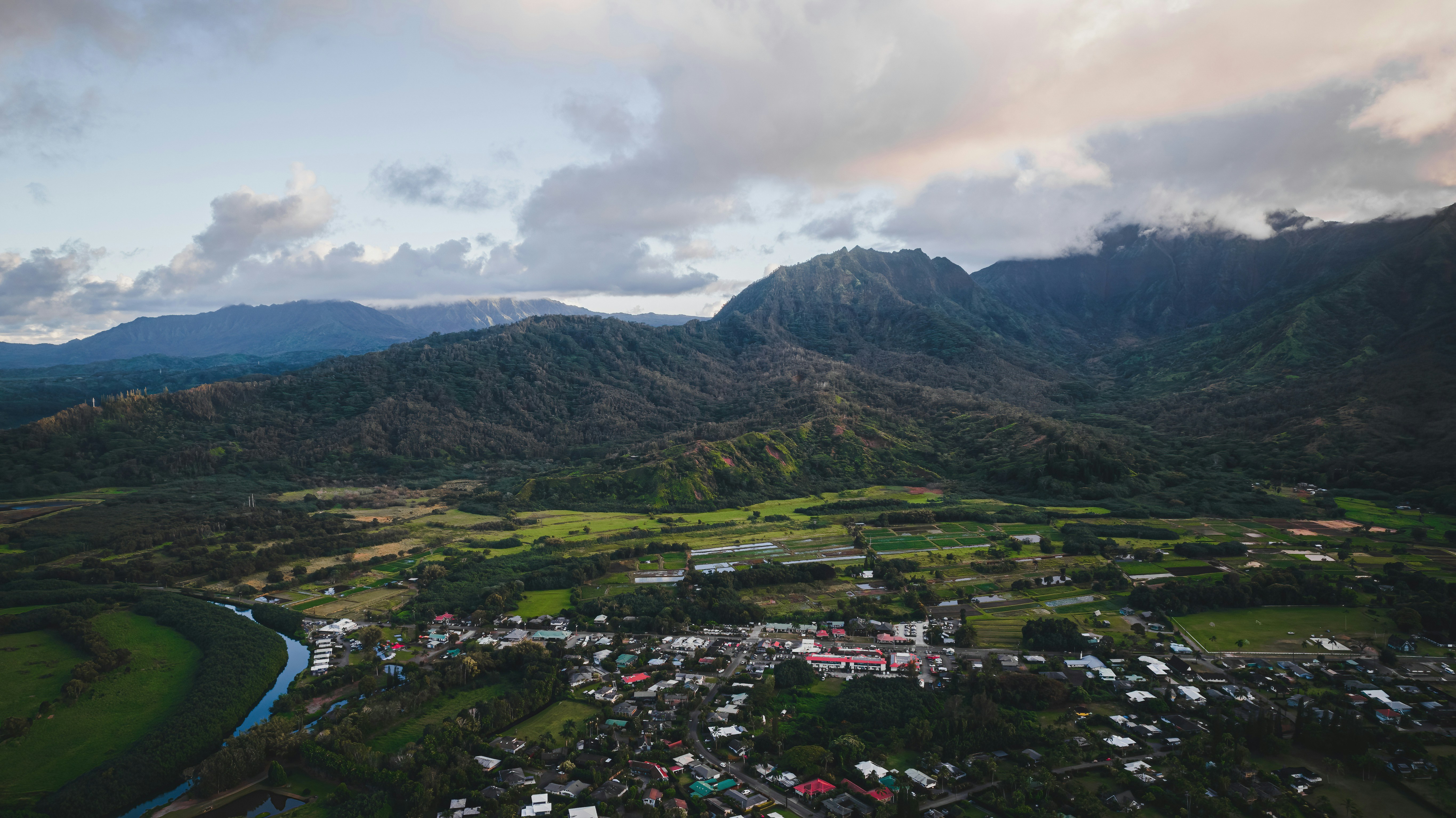 An aerial view of a town surrounded by mountains