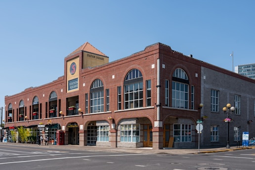 A large brick building sitting on the corner of a street