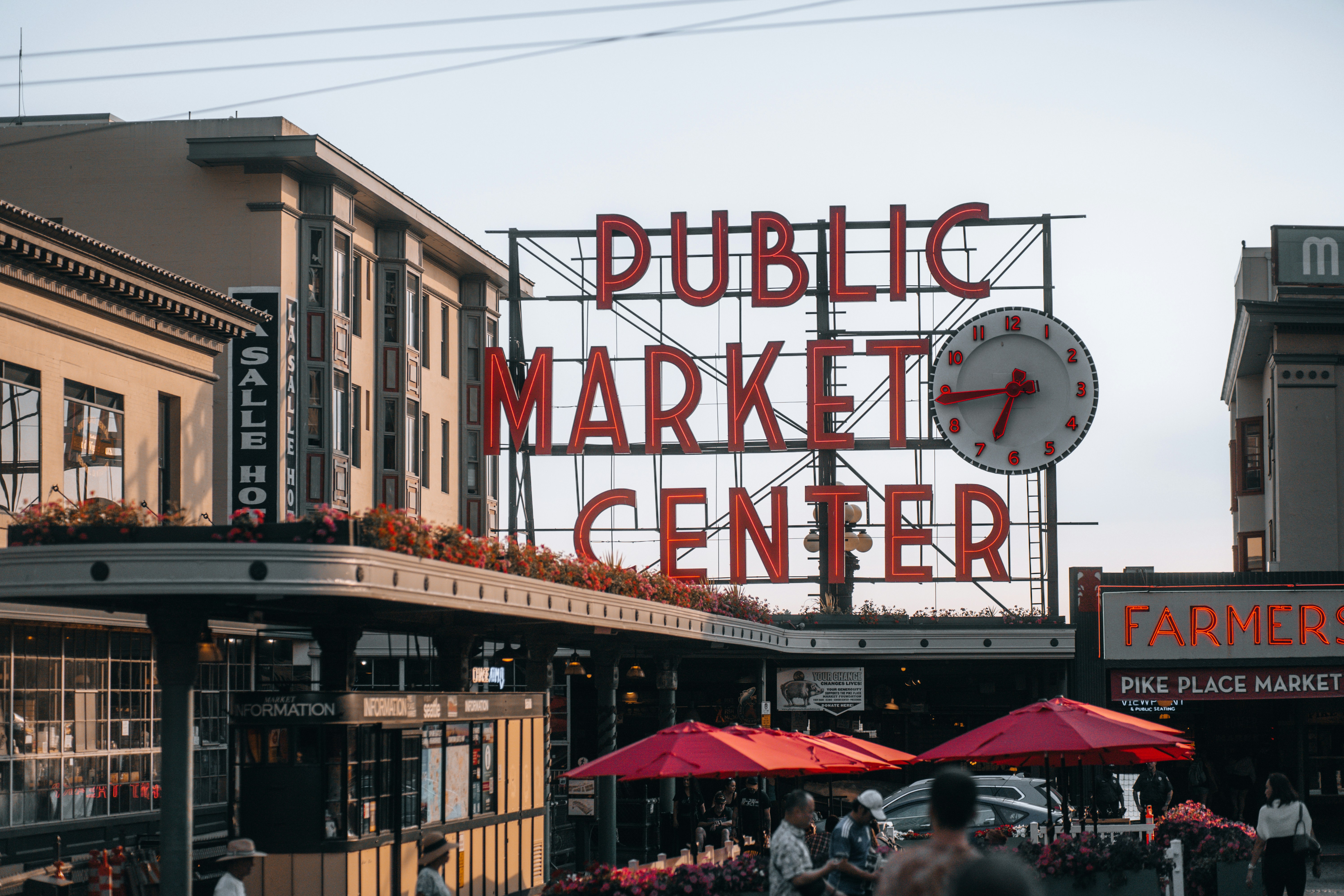 A public market center with people walking around