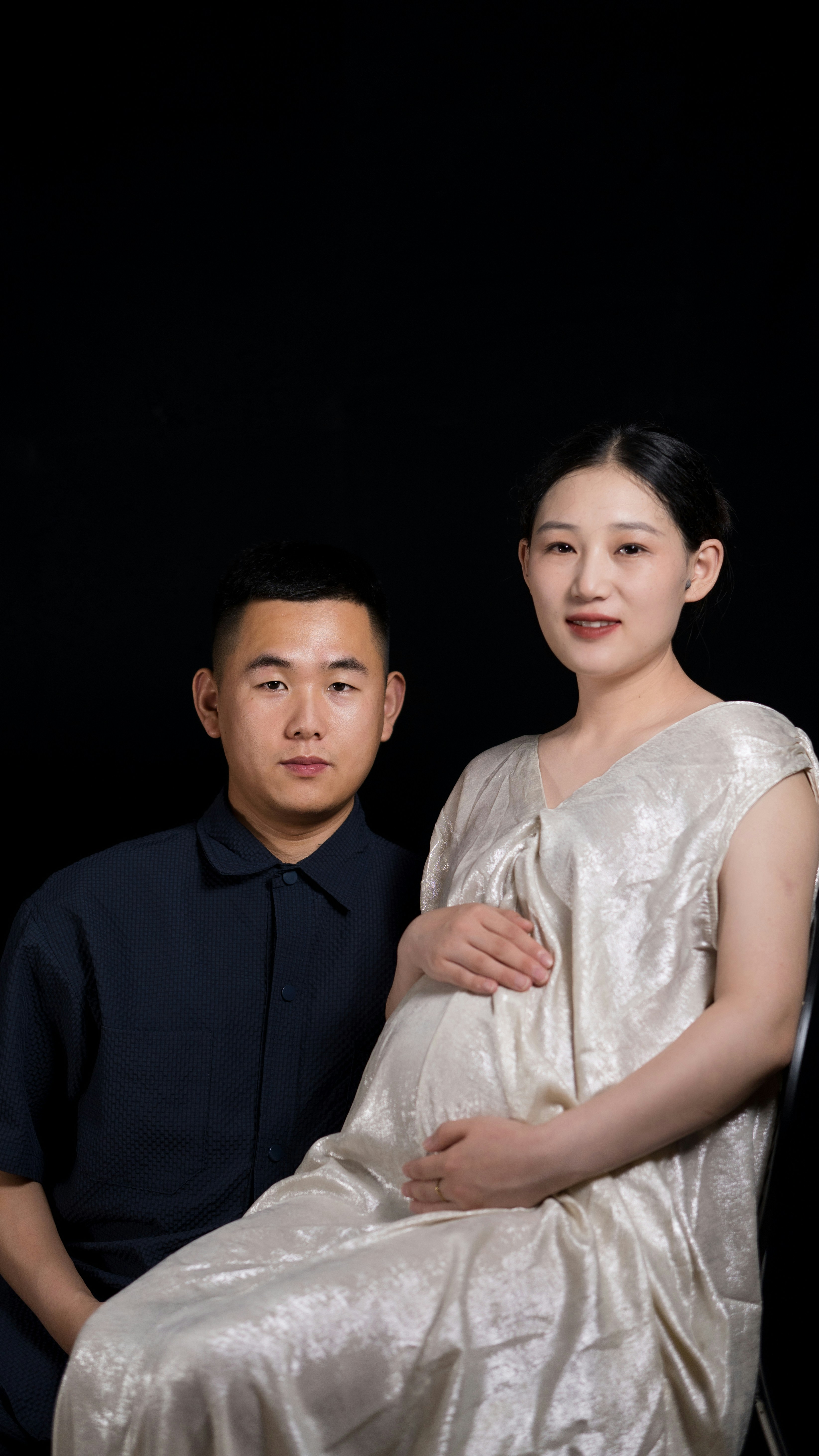 A man and a woman posing for a picture