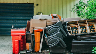 A pile of trash sitting in front of a garage