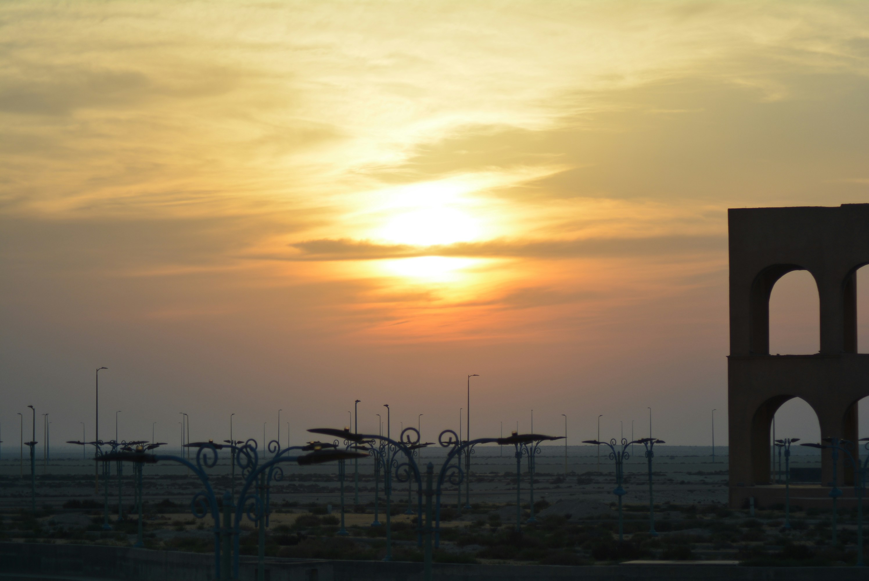 Post-apocalyptic landscape with mechanical creatures and golden sunset