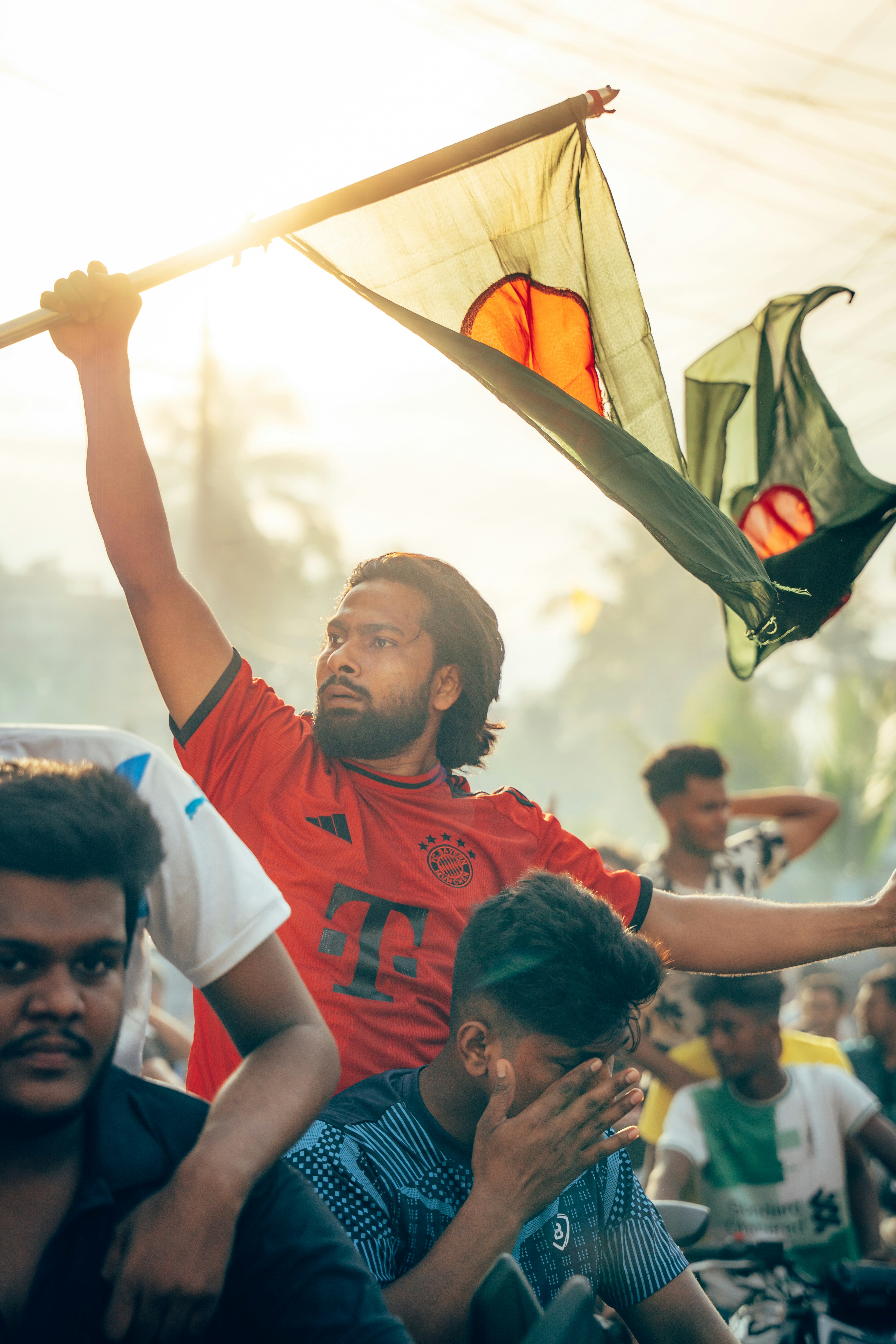 A man holding a kite in the air