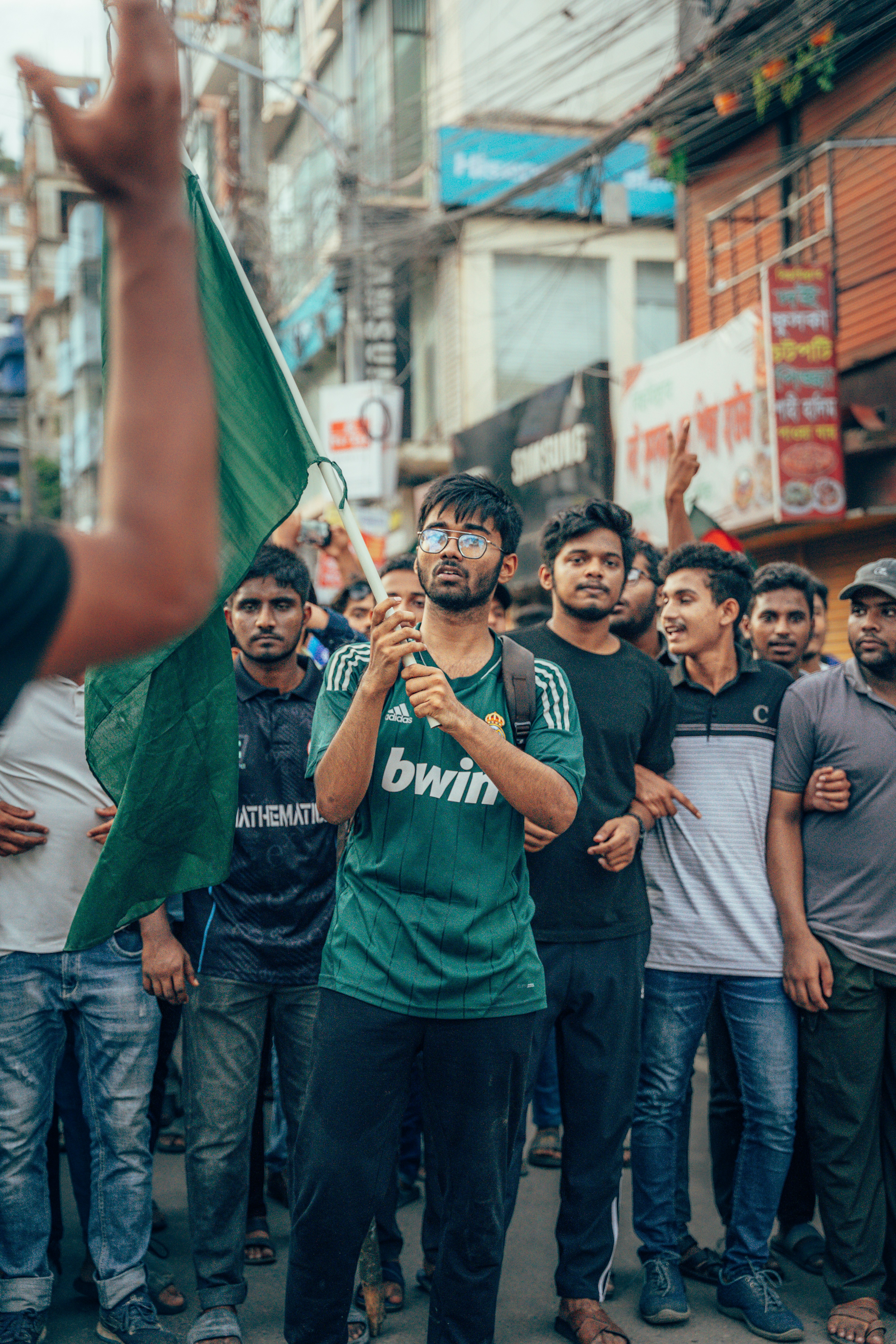 A group of people standing around each other