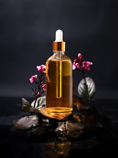 A bottle of oil sitting on top of a table