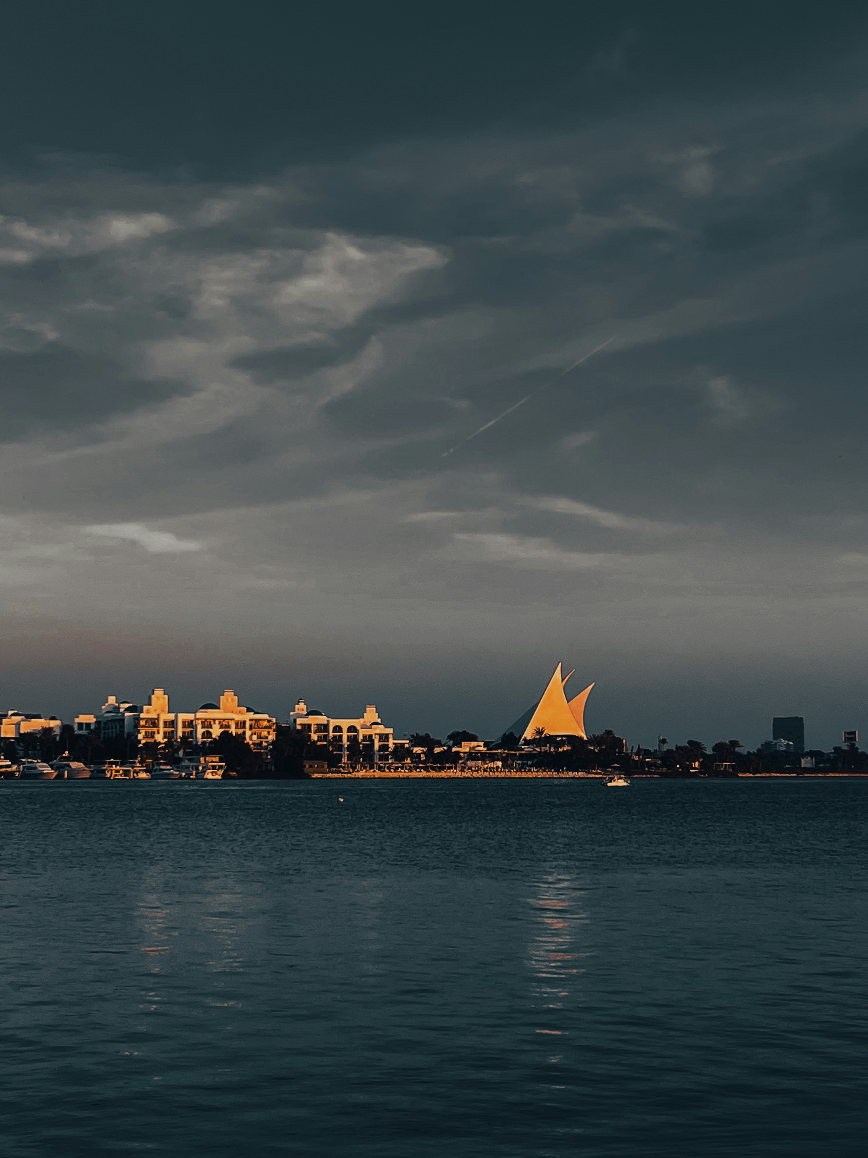 A large body of water with a city in the background