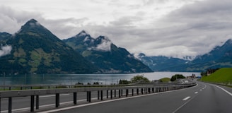 A view of a road with mountains in the background