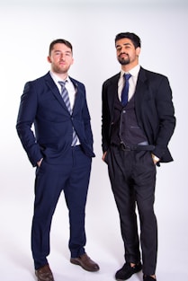 Two men in suits standing next to each other