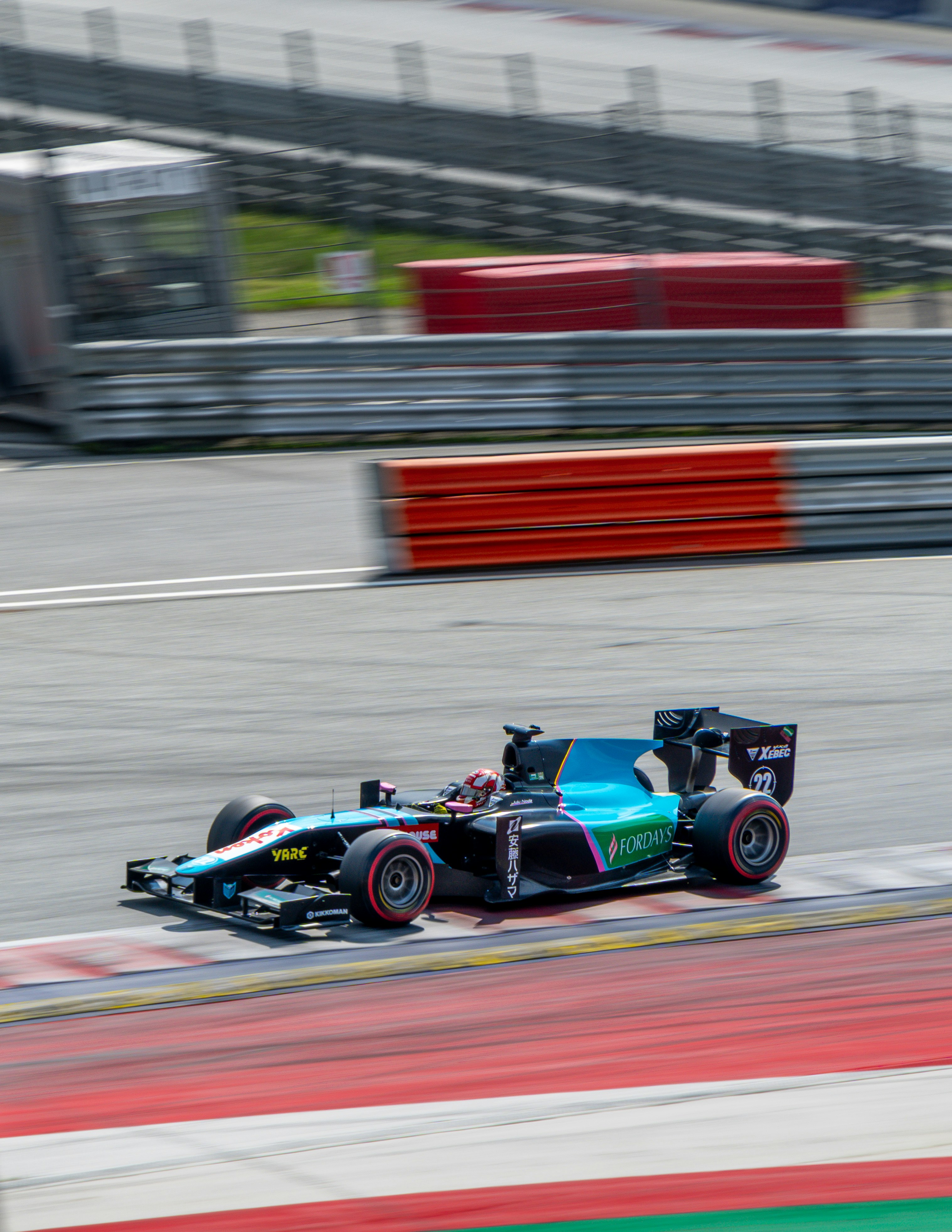 A racing car driving down a race track