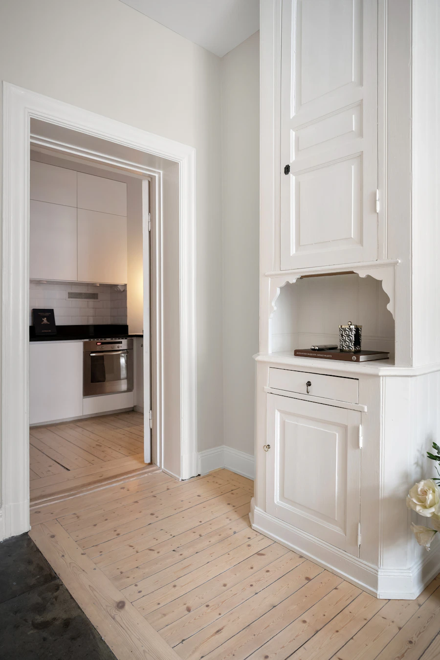 Freshly refinished white kitchen cabinets after A&C Painting's cabinet painting service in a Norcross home