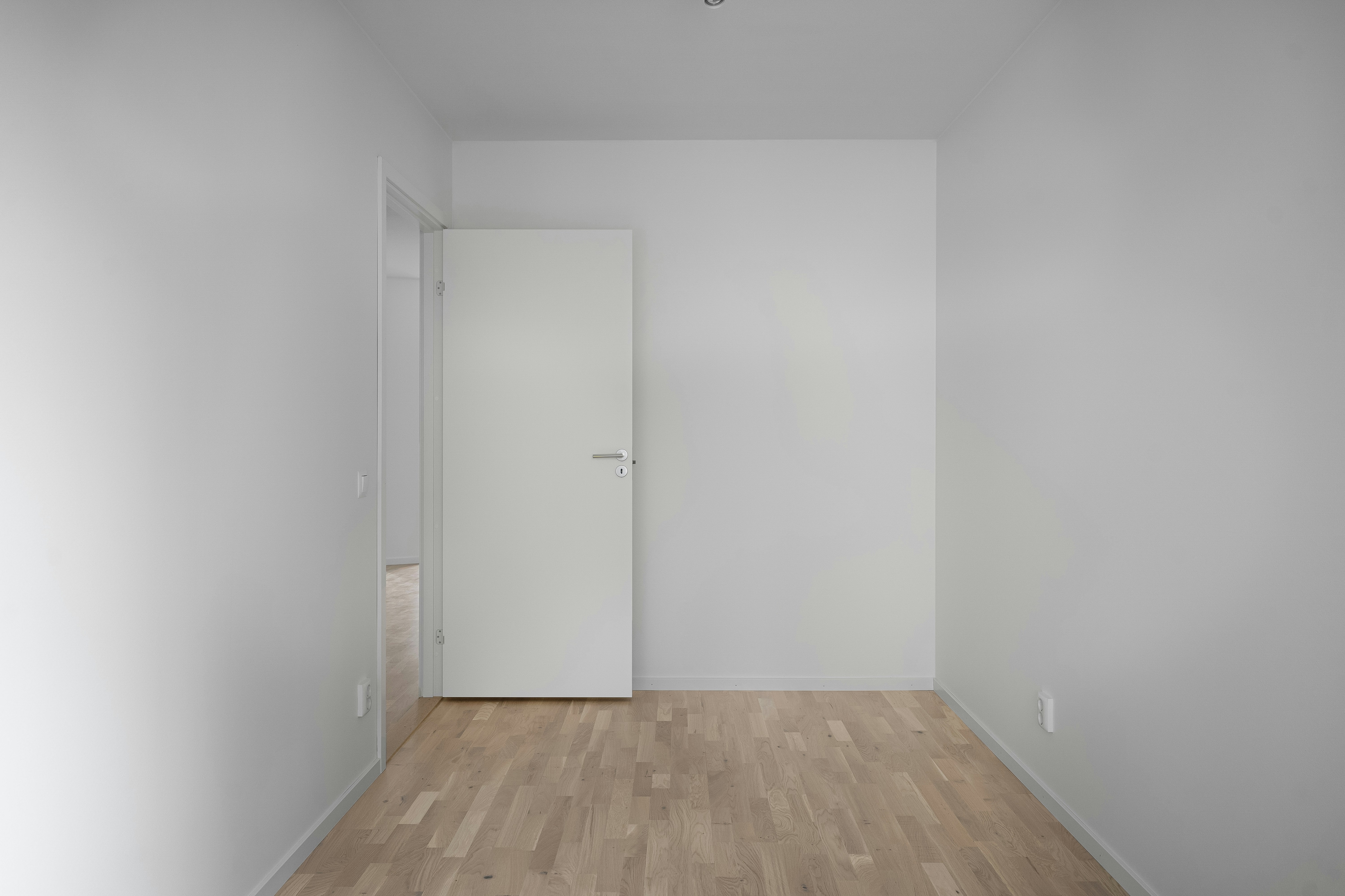 homeowner measuring room for flooring quote - flooring suppliers near me