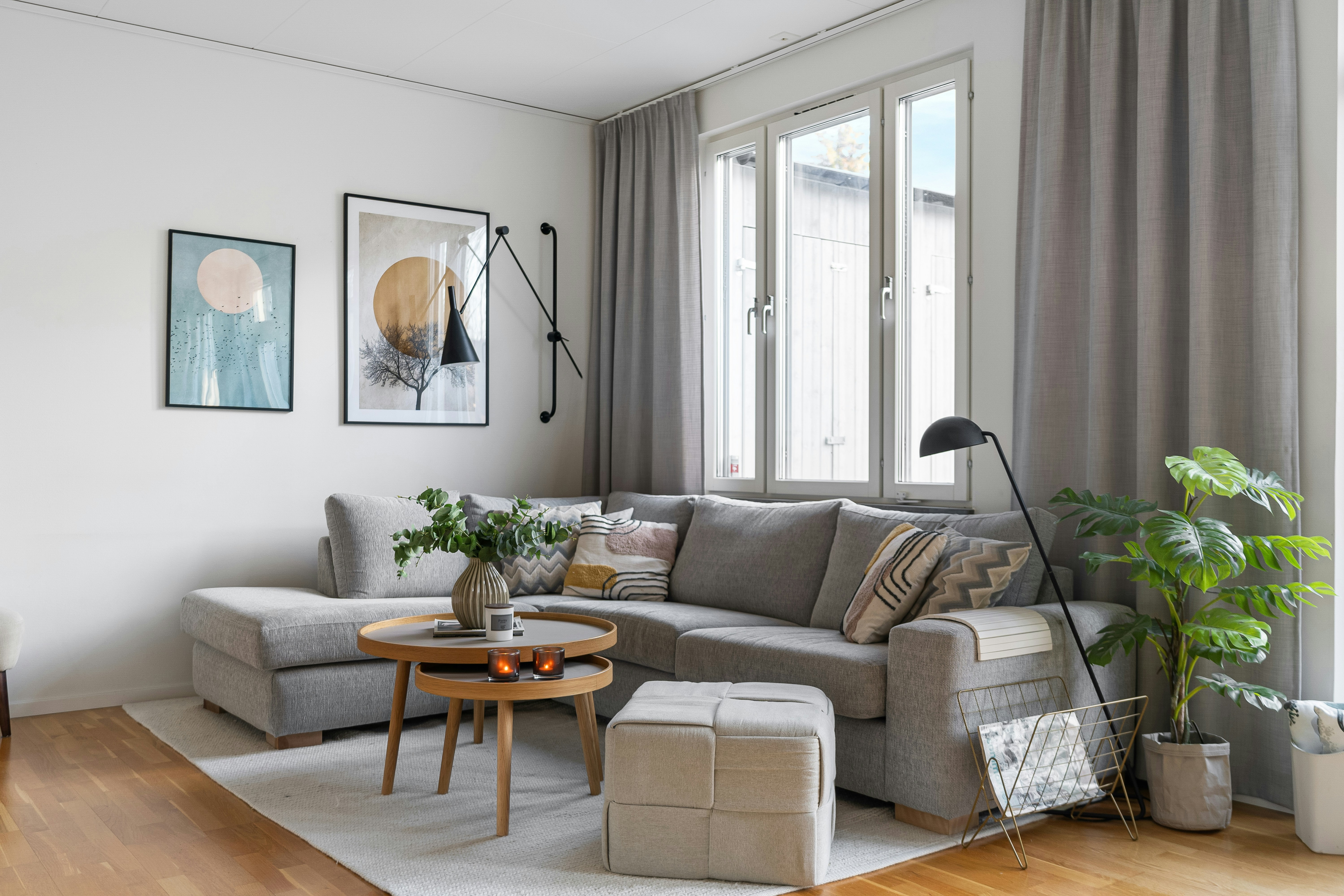 A living room filled with furniture and a large window