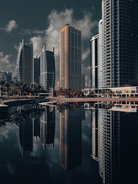 A city with tall buildings and a body of water